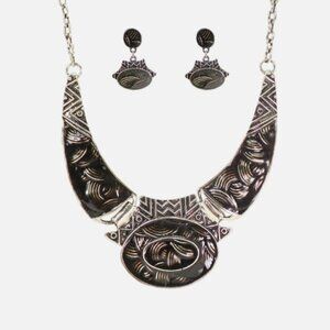Large black and silver large necklace earring set with textured swirl designs